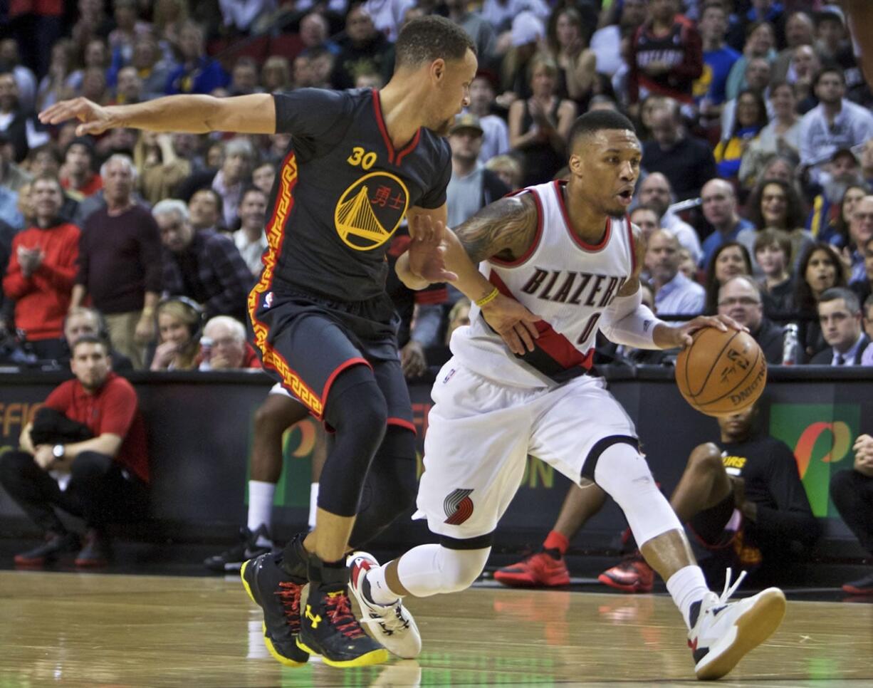 Portland’s Damian Lillard (0) got the better of Golden State’s Stephen Curry, left, during their last meeting on Feb. 19 with a 51-point effort and a win.