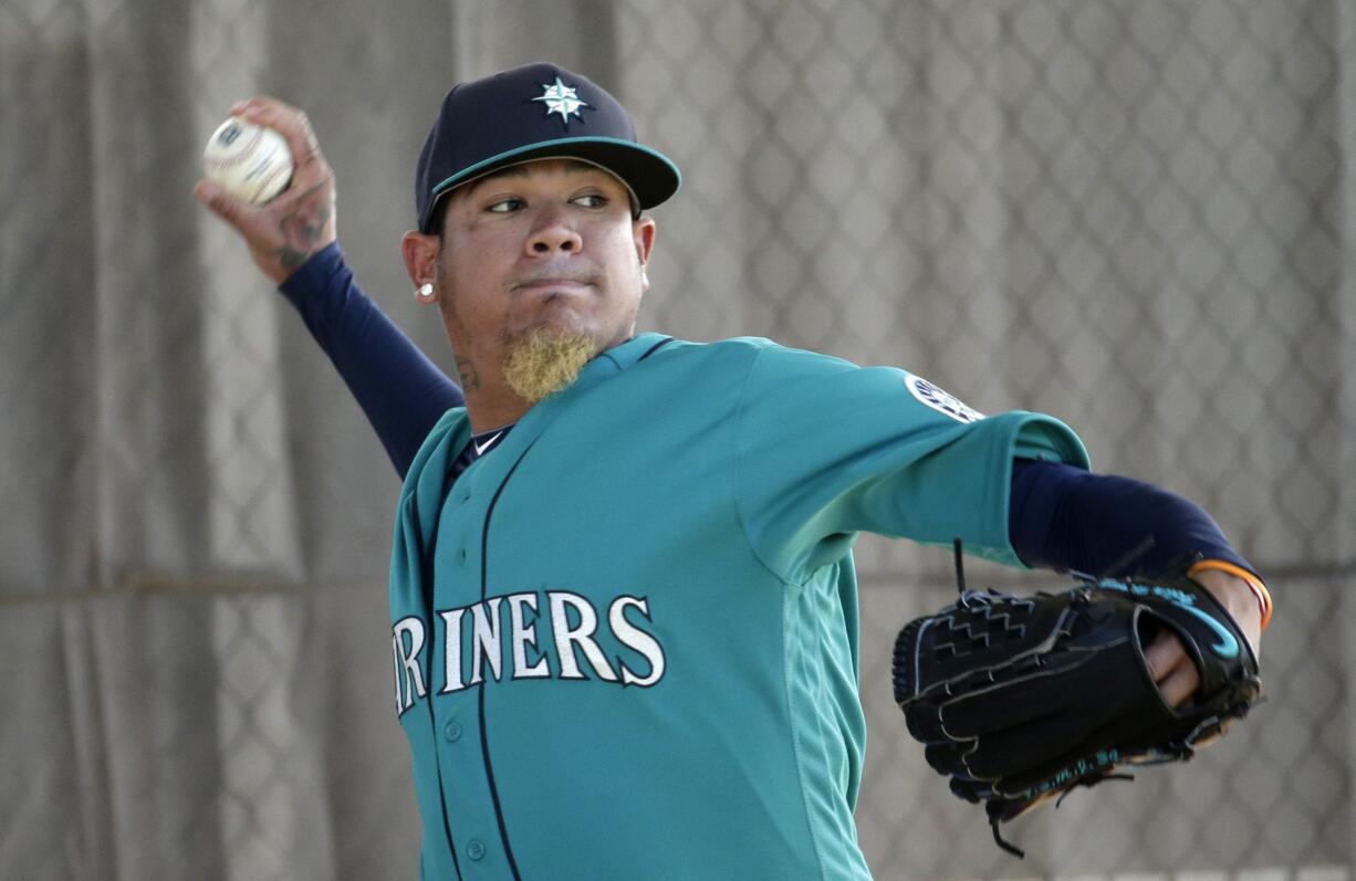 Seattle Mariners starting pitcher Felix Hernandez throws during spring training baseball practice Saturday, Feb. 27, 2016, in Peoria, Ariz.