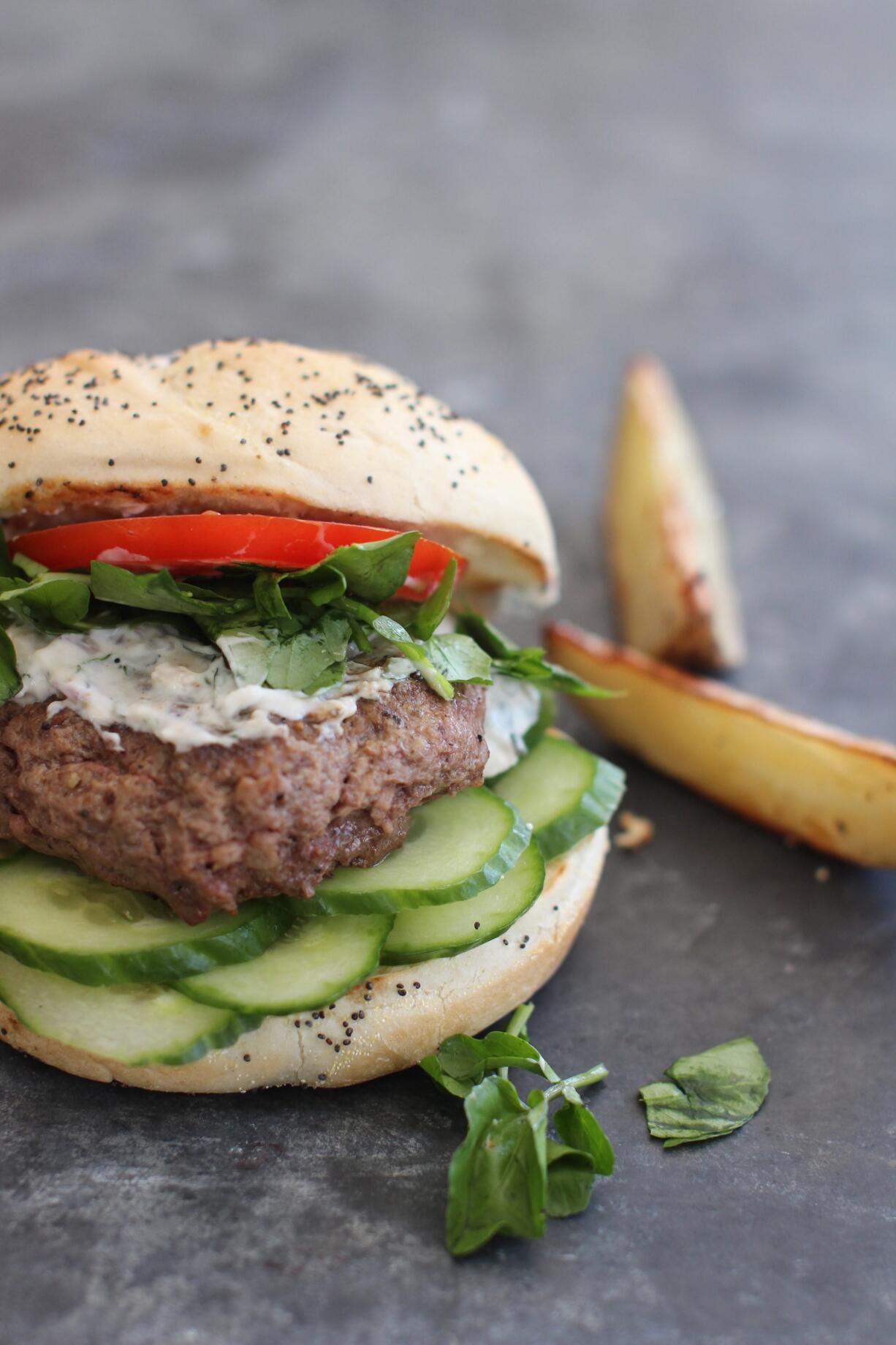 Whether simple or gourmet, such as this lamb burger with watercress and creamy mint sauce, burgers can be found on menus across the globe.