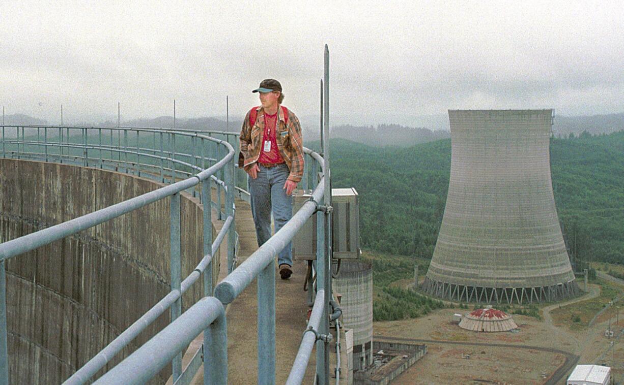 Energy Northwest employee Randy Crawford walks around the top of a cooling tower in Satsop, Wash., in 1999. The Energy Facility State Evaluation Council approved the nuclear project, though it was never completed.