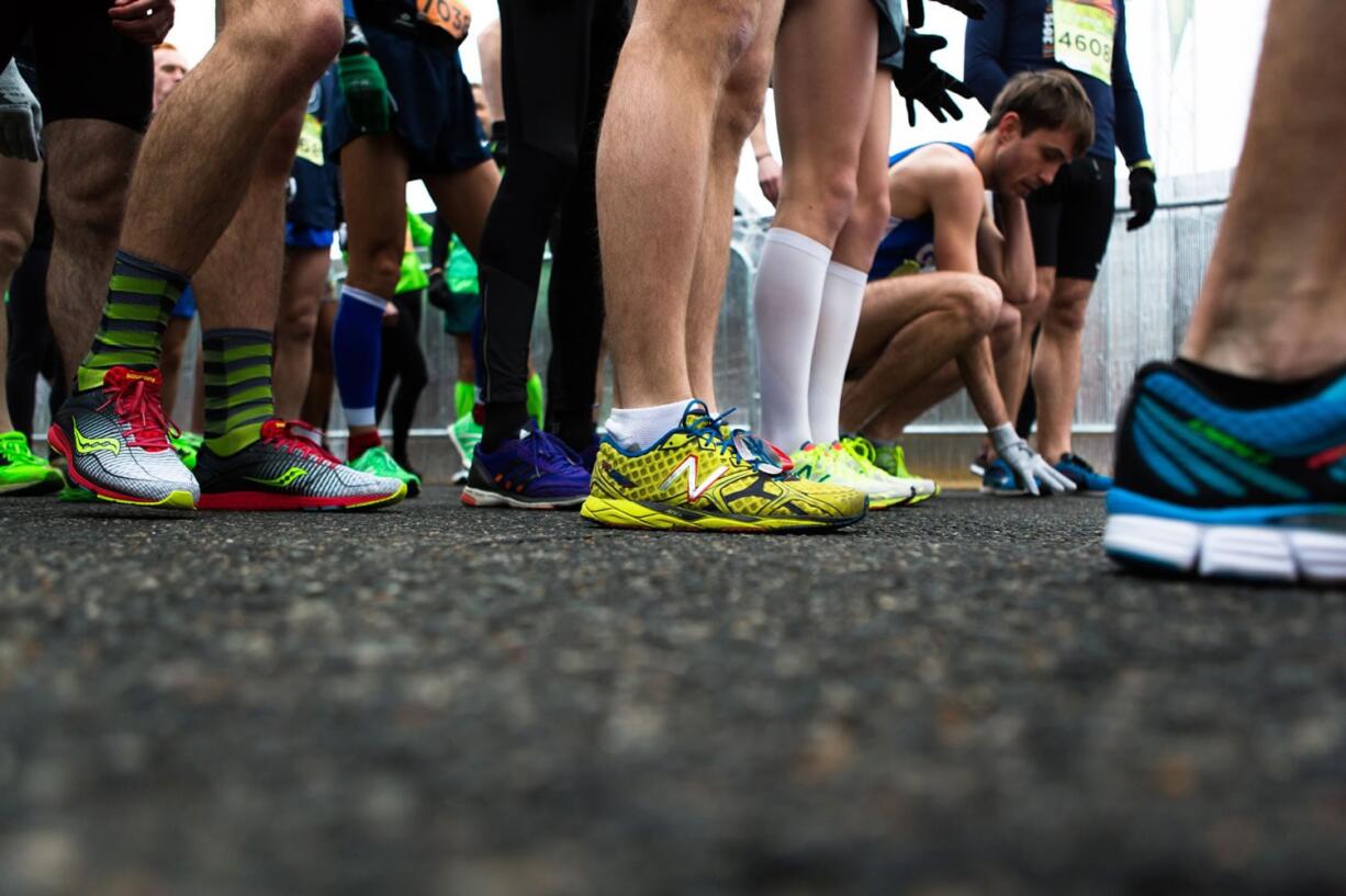 Elite runners line up on the morning of March 6 near the Washington Monument prior to taking part in the St. Patrick&#039;s Day run put on by Pacers Running.