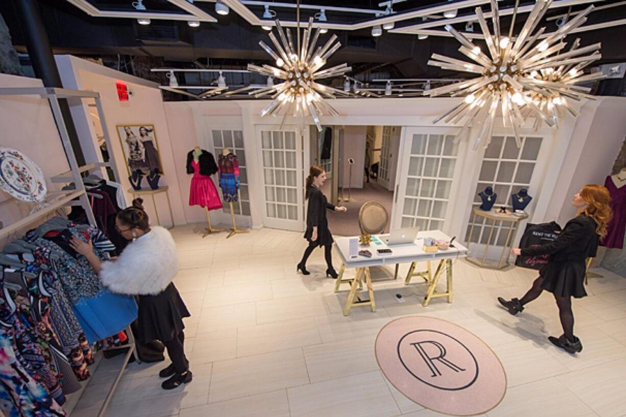 Women browse in a Rent the Runway brick-and-mortar store in Washington. Are women ready to rent their work wear? Rent The Runway bets yes.