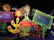 Signs near the end of Magic Kingdom&#039;s &quot;it&#039;s a small world&quot; display names of riders wearing MagicBands.