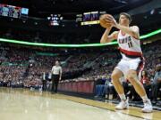 Portland Trail Blazers forward Meyers Leonard shoots a 3-point basket against the Orlando Magic during the second half of an NBA basketball game in Portland, Ore., Saturday, March 12, 2016.