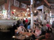 Walls are plastered with dollar bills at the Superstition Restaurant and Saloon in Tortilla Flat, Ariz.