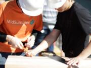 Students at Evergreen High School work on Habitat for Humanity&#039;s Geometry in Construction program last year. A $25,000 grant from the Vancouver Energy Foundation will help support the program, in which students earn credit while building a home to be sold at cost to a low-income family.