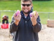 Hazel Dell: Pastor Brian Larsen gets in on the Easter egg hunt fun at St. John Lutheran Church.