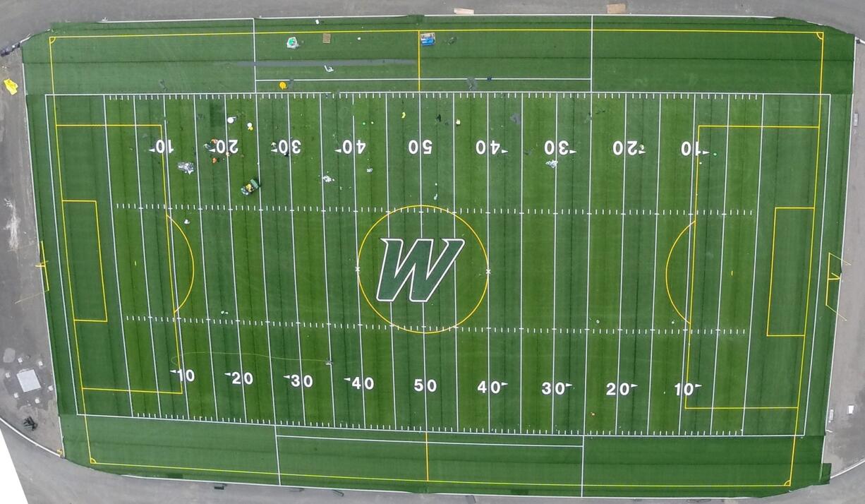 Woodland used this photo taken from a drone to check out the installation of its new football field, including placement of the newly designed &quot;W&quot; logo at the center of the field.