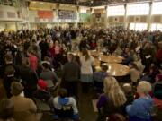 Democratic caucus-goers fill the cafeteria Saturday at Hudson's Bay High School.