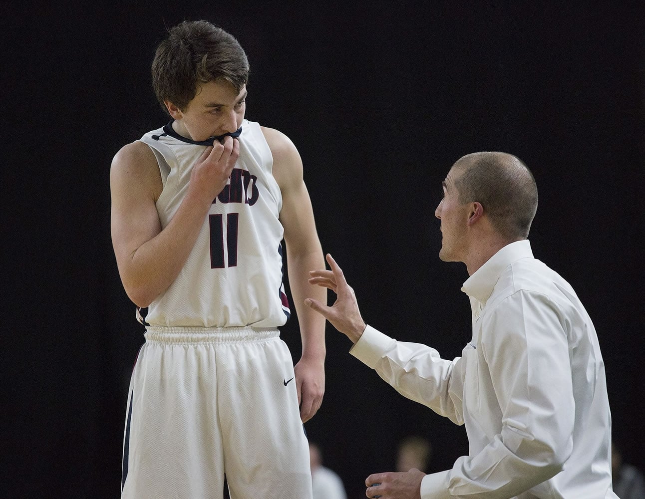 King's Way Christian High Schools Karter Graves listens to head coach Daven Harmeling during the second half of King's Way Christian's game against Medical Lake High School March 3, 2016 game in the state class 1A boys basketball tournament in the Yakima SunDome in Yakima, Wash. King's Way Christian beat Medical Lake 47-45.