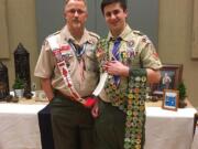 Jourdan Hale, right, receives his final three merit badges and his Order of the Arrow vigil feather recently with Ron Shake, eagle chair for the Boy Scouts of America&#039;s Columbia Gorge district.