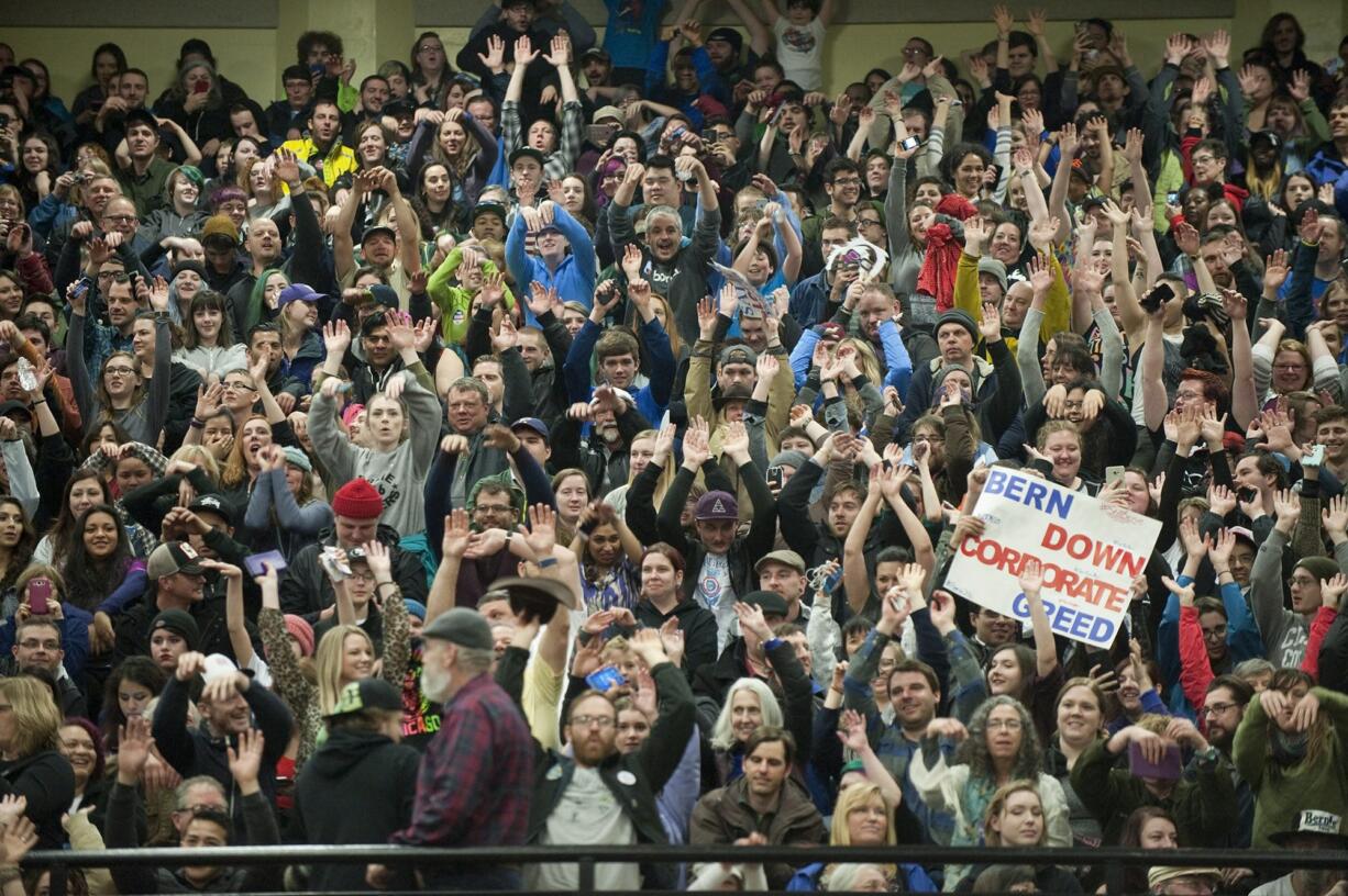 Supporters of Democratic presidential candidate Bernie Sanders cheer at the candidate&#039;s rally at Hudson&#039;s Bay High School in Vancouver on Sunday. Sanders urged the crowd to vote in next Saturday?s Democratic caucuses.