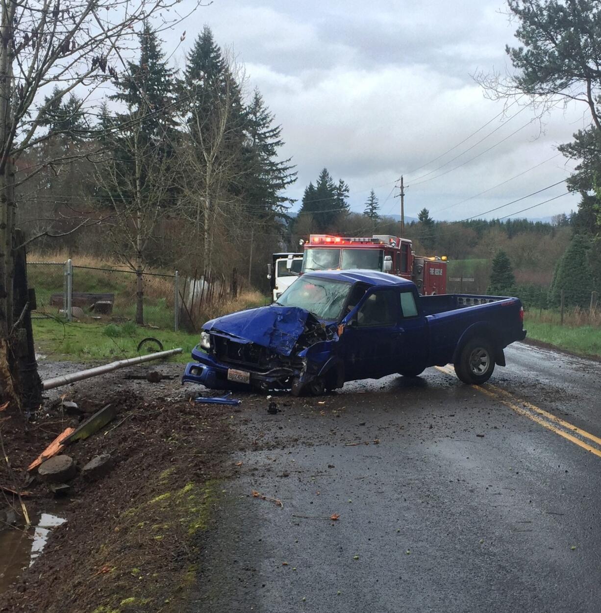 A man was hospitalized after this truck rammed into a tree north of Ridgefield Monday afternoon.