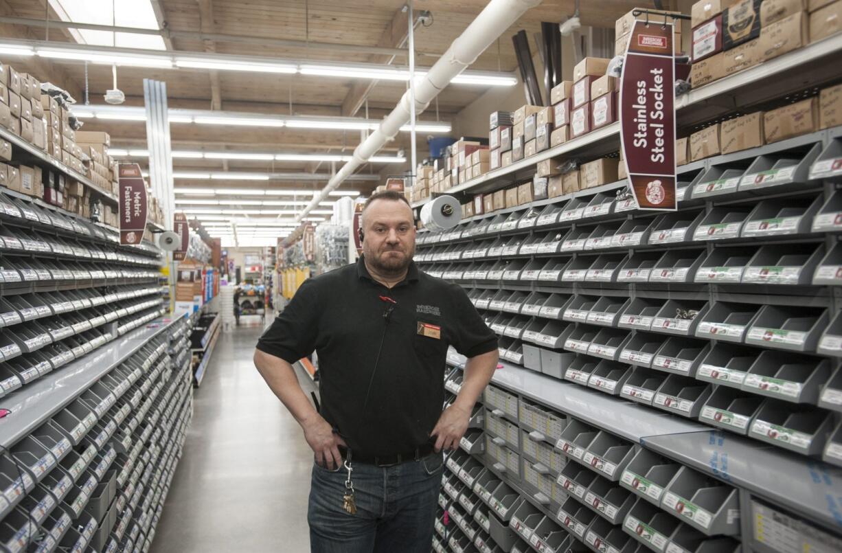 Parkrose Hardware store manager John Coppola stands among his store&#039;s expansive selection of nuts, bolts, and screws at the company&#039;s new store In Vancouver's North Garrison Heights neighborhood. The store, which boasts an inventory of more than 9,500 types of fasteners, will celebrate its grand opening this weekend.