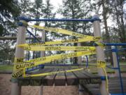 A broken play structure at Cascade Park in Vancouver is wrapped in &quot;caution&quot; tape. The city is spending $50,000 on new playground equipment for the park.