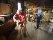 Eighth-grader Sophia Pettis, right, on Friday sets up a 360-degree camera next to carpenter volunteer Mick Robins at Fort Vancouver National Historic Site. Students from iTech Preparatory Middle School are creating a virtual reality tour of Fort Vancouver.