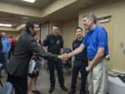 Dr. Jaime Nicacio, left, greets his former patient, Rick Jarvis of Camas, as Jarvis&#039; wife, Charlotte, firefighter Obie Bowman, right of her, and paramedic/firefighter Brian Quintana, right of Bowman, look on during a case review Thursday morning at PeaceHealth Southwest Medical Center. Rick Jarvis attended the case review to personally thank the first responders and medical providers who cared for him after an October car wreck.