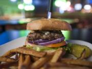 A blue cheese crumble and mushroom burger is served March 3 at the Back Alley Bar &amp; Grill on East Mill Plain Boulevard in Vancouver.