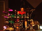 Woodland: Truth Be Told drummer Thomas Roberts performs with his band at a concert benefiting Woodland Action Center.