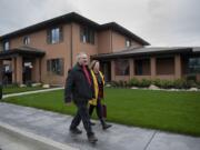 Tracy and Teresa Phillips leave the new Fisher House after attending the dedication ceremony Wednesday. The Fisher House program aided the family after their nephew, Sgt. John Kyle Daggett, was mortally wounded in Iraq in 2008. The family made a $10,000 donation to the program in his memory.