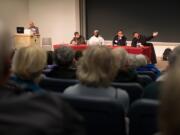 Four panelists, from left, Shirin Elkoshairi, Tervaris Evans, Michael Chrzastowski and Brian Shahid, answer audience questions Sunday afternoon during a talk titled &quot;A Conversation with Your Muslim Neighbors&quot; at Washington State University Vancouver.