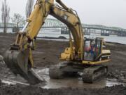 Stewart Brewer of Robertson &amp; Olson Construction runs an excavator Wednesday at the downtown Vancouver waterfront area, preparing the site for the city&#039;s 7-acre park and Renaissance Trail extension.