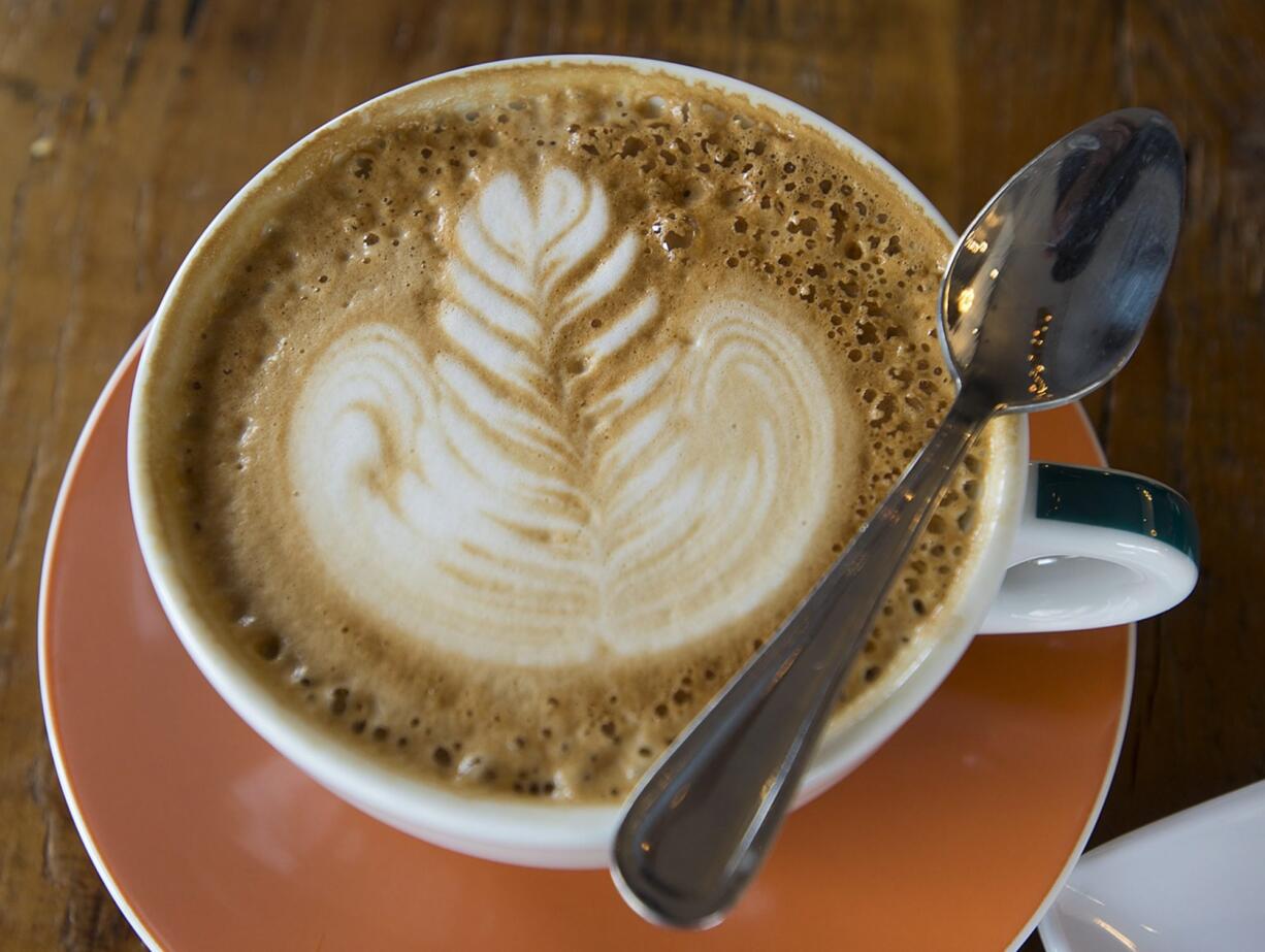 A latte is served at Compass Coffee Roasting in downtown Vancouver. The coffee shop recently moved from a space on Main Street to one on Washington Street.