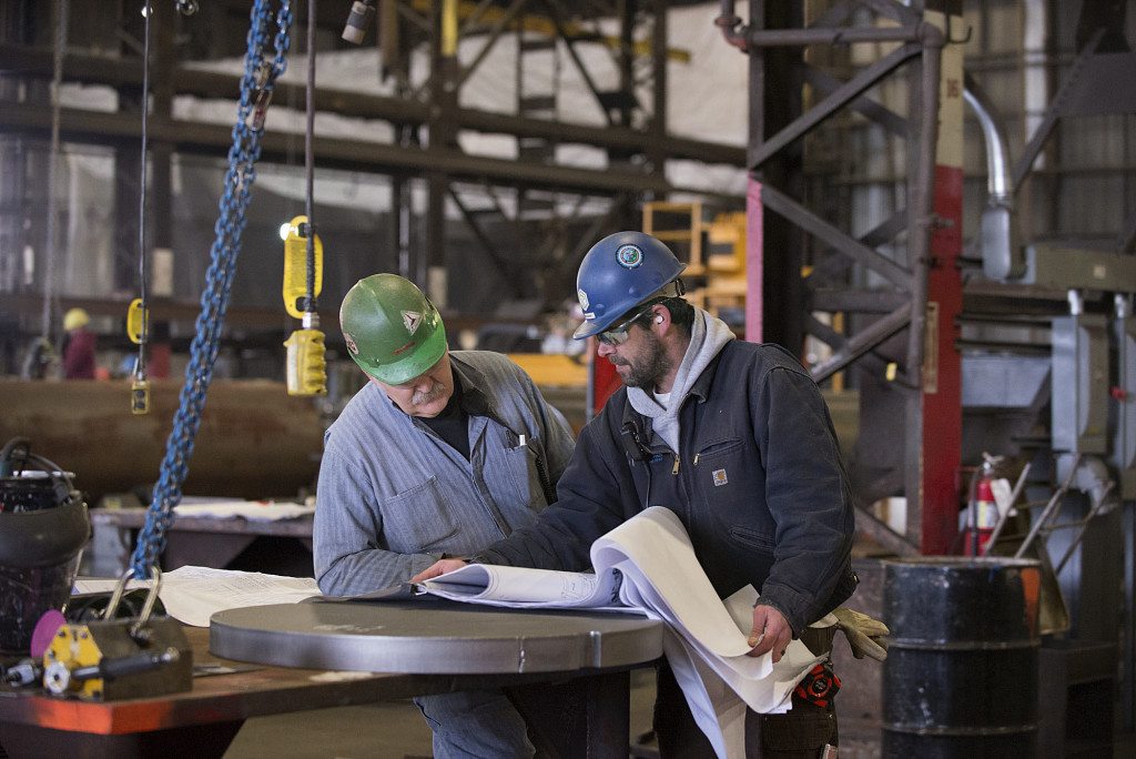 Thompson Metal Fab employees George Mason, left, and Mike Marsh look over shop drawings in 2016 at the company&#039;s Vancouver shop.