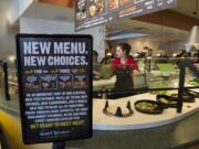 A sign notifies Sweet Tomatoes guests about that the Vancouver restaurant is a test site for adding meat items to its menu (Photos by Amanda Cowan/The Columbian)