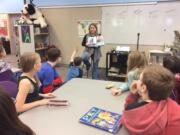 Washougal: Students in Sam Persinger&#039;s 5th grade class at Hathaway Elementary checking out new book on animals.