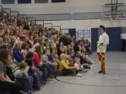 Washougal: Seattle prop comic, Alex Zerbe entertains kids at Gause Elementary.