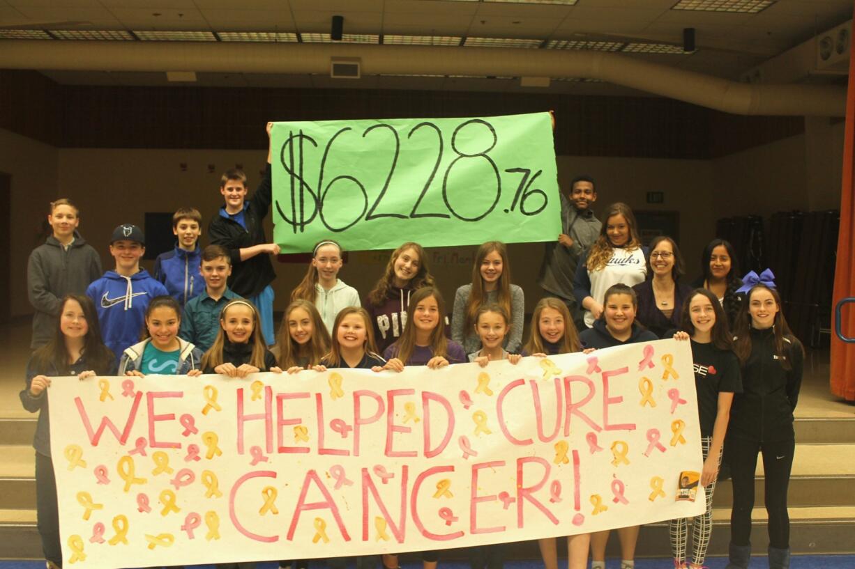 Hockinson: Kendall Jones, second row, second from the right, with her leadership students holding a poster showing the final tally for their &quot;Penny&#039;s for Patients&quot; fundraiser benefiting the Leukemia and Lymphoma Society.