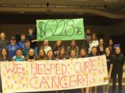 Hockinson: Kendall Jones, second row, second from the right, with her leadership students holding a poster showing the final tally for their &quot;Penny&#039;s for Patients&quot; fundraiser benefiting the Leukemia and Lymphoma Society.