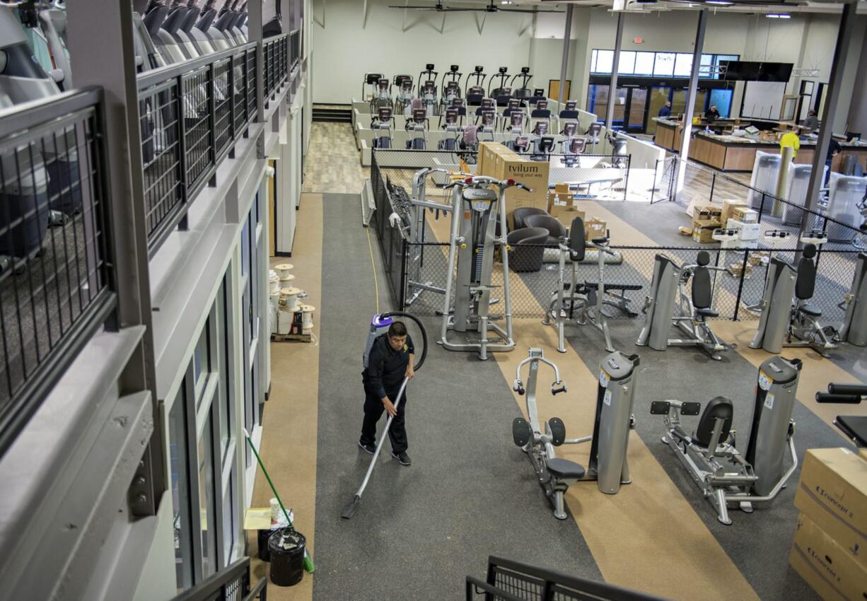 Cesar Fernandez of Gold&#039;s Gym prepares for the March 24 opening Thursday morning at Vancouver Mall.