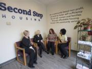 Denise Stone, from left, and Debby Dover of Second Step Housing chat with program client Amanda Owens and Armetta Burney of Clark College about their new partnership. The college can now directly refer homeless students to Second Step, which provides housing.