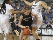 Skyview&#039;s Ashlee Comastro tried to dribble between Todd Beamer&#039;s Jahpera Mceachin (10) and Makenzie Bond (34) in a 2016 WIAA Girls 4A Hardwood Classic State Basketball game held in the Tacoma Dome on Mach 3, 2016. Todd Beamer beat Skyview 40-35.