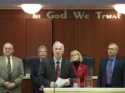 Clark County council Chair Marc Boldt, center, joins fellow Councilors Tom Mielke, from left, Julie Olson, Jeanne Stewart and David Madore to address the crowd March 22 at the Clark County Public Service Center.