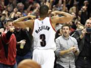 Portland Trail Blazers guard C.J. McCollum (3) celebrates after scoring late in the fourth quarter of an NBA basketball game against the Philadelphia 76ers in Portland, Ore., Saturday, March 26, 2016. The Blazers won 108-105.