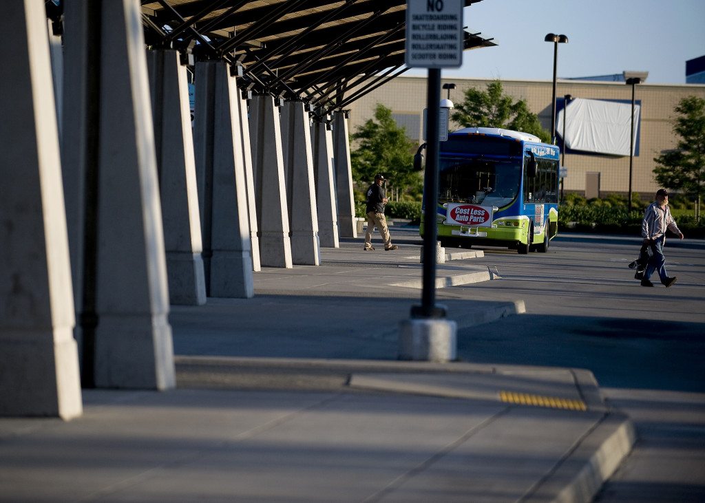 Passengers disembark buses at the 99th Street Transit Center on Thursday July 28, 2011.