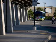 Passengers disembark buses at the 99th Street Transit Center on Thursday July 28, 2011.