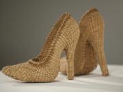 A pair of high heels, titled &quot;Too Haida&quot; by Lisa Telford, are on display at a contemporary native basketry exhibit at Clark College&#039;s Archer Gallery in Vancouver.