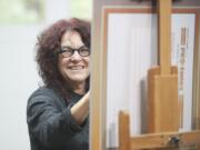 Hilarie Couture paints Linda Glover's portrait as the nonprofit leader sits in the artist's Vancouver studio.