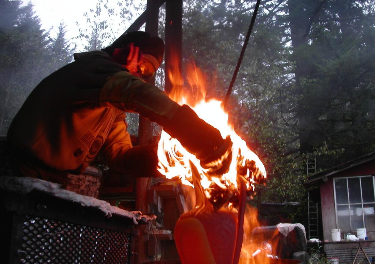 Dave Deal fires &quot;Egret Ewer&quot; in his kiln.