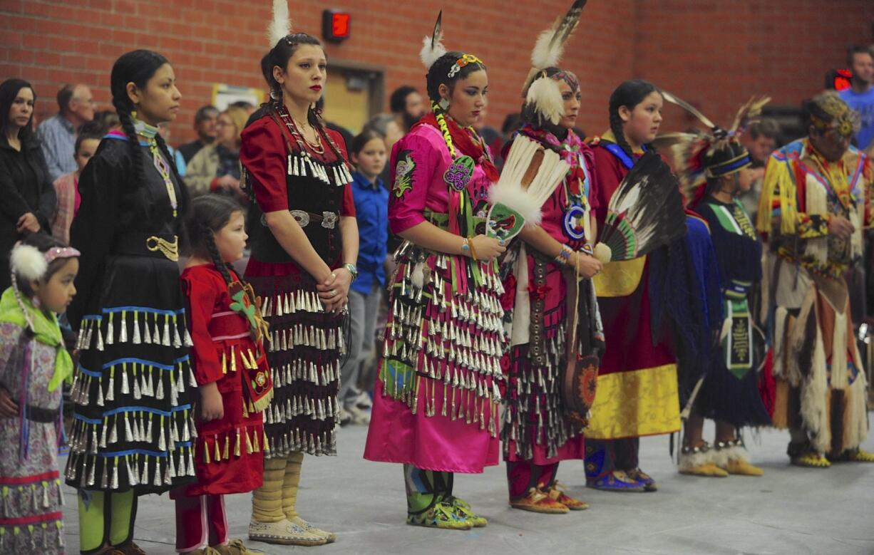 Dancers listen to speakers Saturday at the Annual Traditional Pow Wow at Covington Middle School in Vancouver.