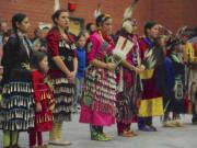 Dancers listen to speakers Saturday at the Annual Traditional Pow Wow at Covington Middle School in Vancouver.