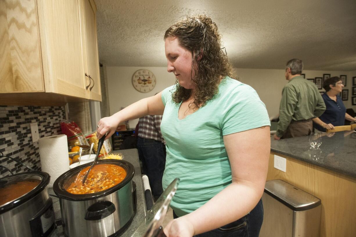 Tara Bouma prepares soup for a neighborhood gathering in Vancouver&#039;s Northwest neighborhood.