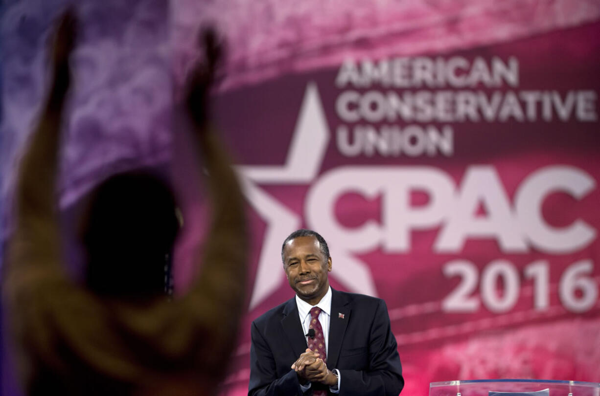 Ben Carson reacts to the crowd as he speaks Friday at the Conservative Political Action Conference in National Harbor, Md., where he formally ended his campaign for president.