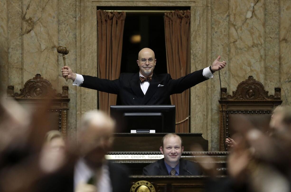 Rep. Jim Moeller, D-Vancouver, and Speaker Pro Tempore of the Washington House, raises his gavel after declaring "Sine Die" Thursday, March 10, 2016, to end the regular session of the Washington Legislature, at the Capitol in Olympia. (AP Photo/Ted S.