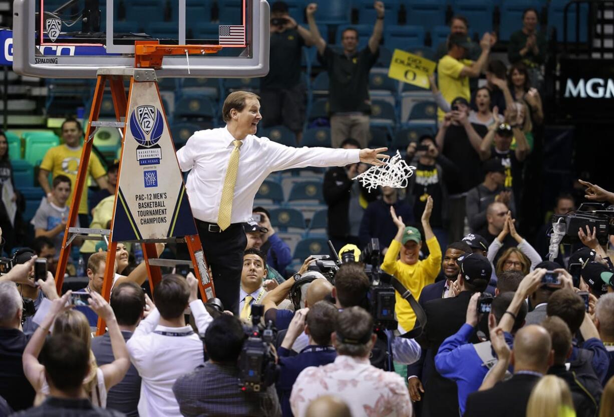 Oregon coach Dana Altman tosses the net while the team celebrates after defeating Utah in an NCAA college basketball game in the championship of the Pac-12 men&#039;s tournament Saturday, March 12, 2016, in Las Vegas. Oregon won 88-57.