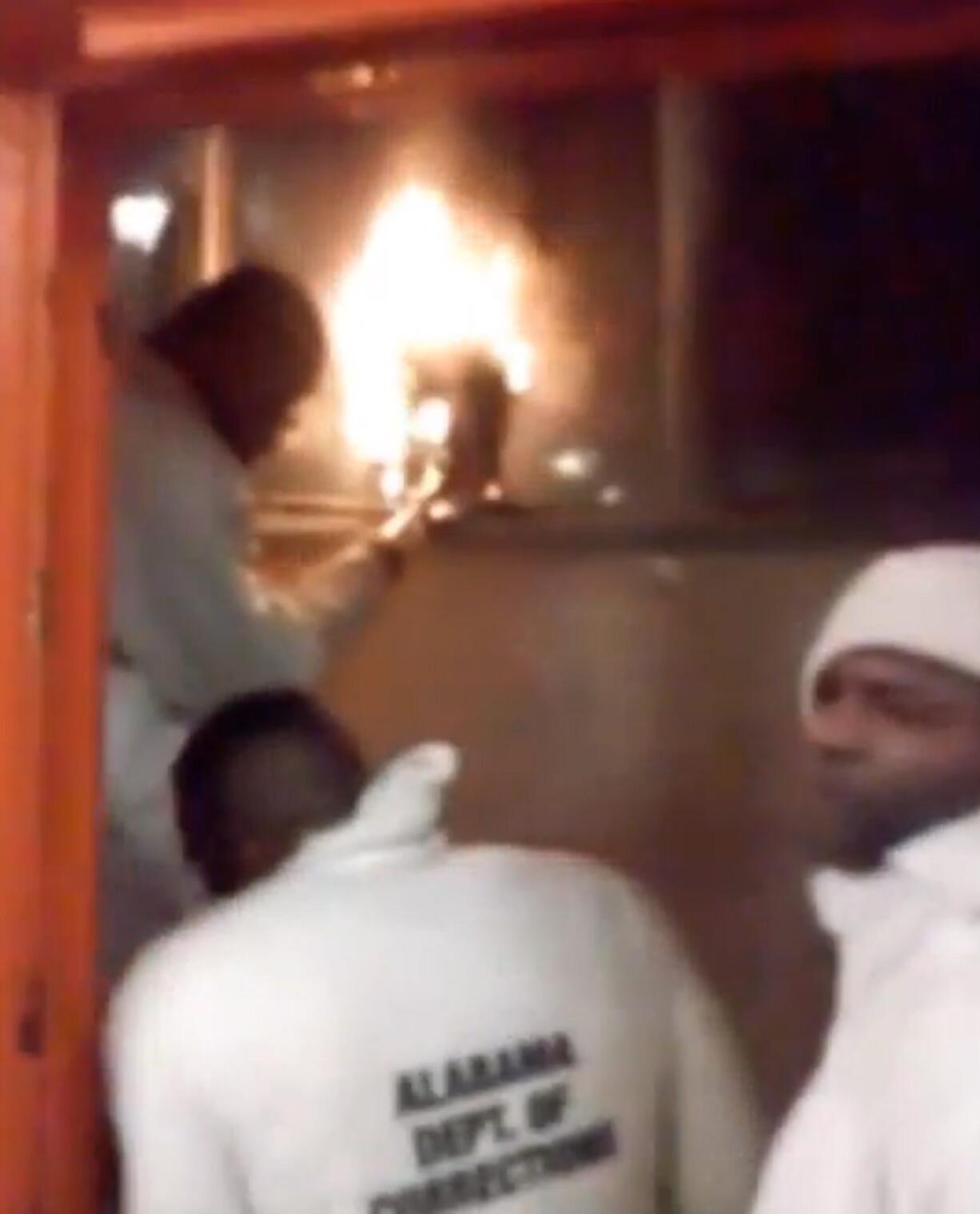 This still image taken from video shot by an inmate from the Holman Correctional Facility shows a prison riot on north of Atmore, Ala., Friday, March 11, 2016.   Department of Corrections spokesman Bob Horton said three emergency response teams were deployed to bring the prison dorm under control. He said the facility is now calm and remains on lockdown Saturday morning. The violence erupted Friday night when an inmate stabbed an officer after refusing to obey the officer?s instructions.